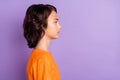 Profile side view portrait of attractive content serious boy copy space isolated over violet purple color background Royalty Free Stock Photo