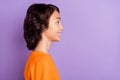 Profile side view portrait of attractive funny cheerful boy copy empty space isolated over violet purple color Royalty Free Stock Photo