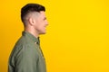 Profile side view portrait of attractive well-groomed cheerful guy copy empty space place isolated over bright yellow Royalty Free Stock Photo
