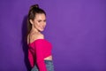 Profile side view portrait of gorgeous busty cheerful girl copy wearing fuchsia crop top space isolated bright violet