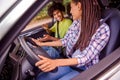 Profile side view portrait of handsome beautiful cheerful couple driving car traveling having fun talking spending Royalty Free Stock Photo