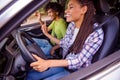 Profile side view portrait of handsome beautiful cheery couple spending weekend driving car having fun traveling good Royalty Free Stock Photo