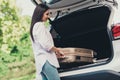 Profile side view portrait of her she nice attractive pretty student lady driver putting valise in truck white car going