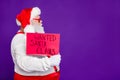 Profile side view portrait of his he nice confident serious bearded Santa showing demonstrating placard wanted search Royalty Free Stock Photo