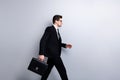 Profile side view portrait of his he nice elegant classy chic attractive guy carrying in hands diplomat attorney lawyer