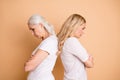 Profile side view portrait of nice attractive groomed gloomy grumpy moody bored tired ladies wearing white outfit folded