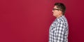 Profile side view portrait of serious handsome middle aged business man in casual checkered shirt and eyeglasses standing and Royalty Free Stock Photo