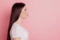 Profile side view portrait of sweet attractive lovely pretty girl sending air kiss isolated over pink background Royalty Free Stock Photo