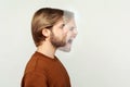 Profile side view portrait of two faced bearded man in calm serious and angry screaming expression