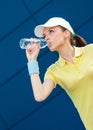 Profile of tennis player drinking water Royalty Free Stock Photo