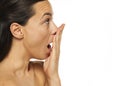 Profile of a tired sleepy woman yawning on a white background