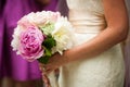 Profile view of bride holding wedding bouquet of flowers Royalty Free Stock Photo