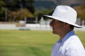 Profile view of umpire standing at field during cricket match Royalty Free Stock Photo