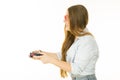 Profile view of woman playing video games