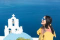 Woman Standing By Church  Against Sky, Thira, Santorini,  Greece Royalty Free Stock Photo