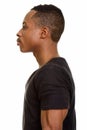 Profile view of young African man isolated against white background