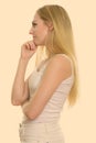 Profile view of young beautiful teenage girl thinking Royalty Free Stock Photo