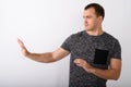 Profile view of young muscular man showing stop hand sign to the Royalty Free Stock Photo