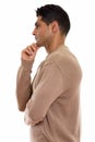 Profile view of young muscular Persian man thinking Royalty Free Stock Photo