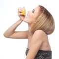 Profile of a woman drinking lemon juice Royalty Free Stock Photo