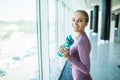 Profile of beautiful woman going to drink some water from plastic bottle after workout Royalty Free Stock Photo