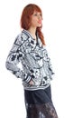Profile of woman with hands in pocket. Redhead girl wearing black and white floral pattern jacket.. Royalty Free Stock Photo