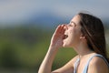 Woman shouting loudly in nature