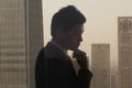 Profile of young businessman contemplating, double exposure of cityscape, Beijing Royalty Free Stock Photo