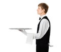 Profile of young handsome waiter holding empty tray with copy sp Royalty Free Stock Photo