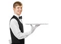 Profile of young handsome waiter holding empty tray with copy sp Royalty Free Stock Photo