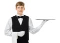 Profile of young handsome waiter holding empty tray with copy sp Royalty Free Stock Photo