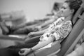 Profile of young lady sitting in medical chair and donating bood Royalty Free Stock Photo