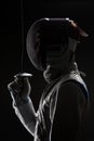 Male fencer with Mask holding the sword in front of his