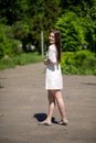 Profile Of Young Smiling Brunette Woman Is In The Park. Royalty Free Stock Photo