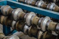 Profiling rolls of roll forming machine close up Royalty Free Stock Photo