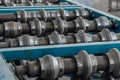 Profiling rolls of sheet forming machine close up Royalty Free Stock Photo