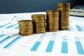 Profit Growth. Stacks of coins and business documents. Investment fund Royalty Free Stock Photo