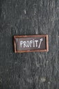 Profit sign on a vintage table