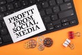Profit From Social Media. Computer keyboard on orange table Royalty Free Stock Photo