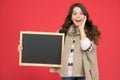 Profitable deal. Happy girl blank blackboard. copy space. Important information. Winter activity advertisement. Time for Royalty Free Stock Photo