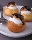 Profiterole with cream and chocolate