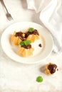 Profiteroles with chocolate sauce Royalty Free Stock Photo