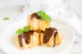 Profiteroles with chocolate sauce Royalty Free Stock Photo