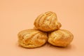 Profiteroles, close-up. Puffs cakes filled with pastry cream. Confectionery, eclair