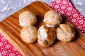 Profiteroles with cream. Delicious cakes made from choux pastry Royalty Free Stock Photo