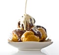 Profiteroles with hot chocolate and cream Royalty Free Stock Photo