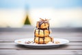 profiteroles stacked on plate with chocolate drizzle