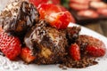 Profiteroles with strawberries and chocolate sauce