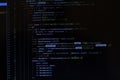 Program code CSS on black background. Computer screen close up. IT or freelance programmer concept. Software develop script on