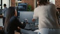 Programer pointing pencil at computer screen with software compiling code explaining source algorithm to coworker Royalty Free Stock Photo